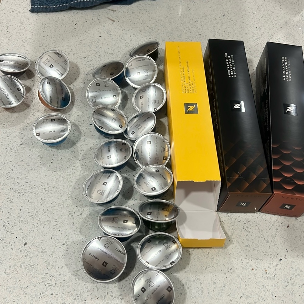 Nespresso Silver and Green Coffee Pods with Black Box